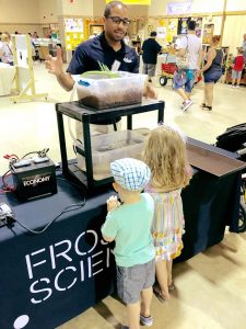 Jaeson Clayborn explaining some of the science behind his self-built hydroponics unit at the 2016 Youth Fair.