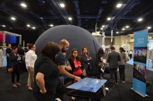Attendees were able to view a flatscreen to navigate the vMAX virtual reality using an avatar. Our portable planetarium stands in the background.